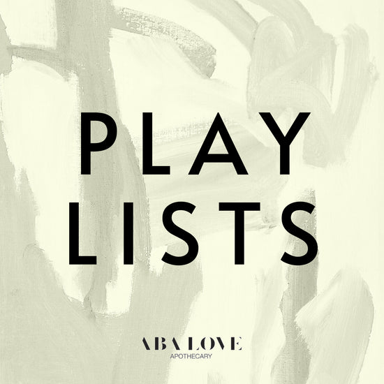 The word Playlists on top of a background photo of oil and water.  At the bottom of the photo reads Aba Love Apothecary