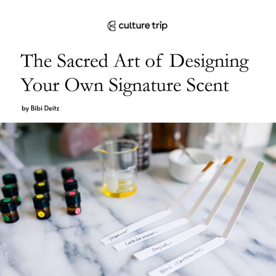 Culture Trip, The Sacred Art of Designing Your Own Signature Scent. A marble table with small brown bottles, a glass beaker with oil and scent testing strip