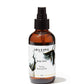 Amber colored bottle with black treatment pump. "Aba Love Apothecary Body Tonic Toning Botanical Oil". The label is white with gold trim and grey flowers.